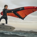 F-One Rocket Wing Crossover board being ridden in the sea with a wingfoil