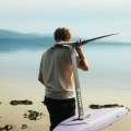F-One UHM Carbon Mast 12 as full set up being carried to the water's edge